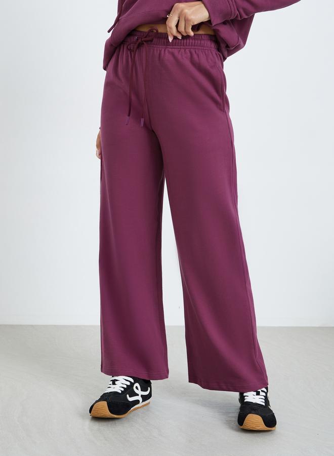 ستايلي طقم منسق من بنطال واسع وهودي بطبعة كتابة جرافيك - Image 3